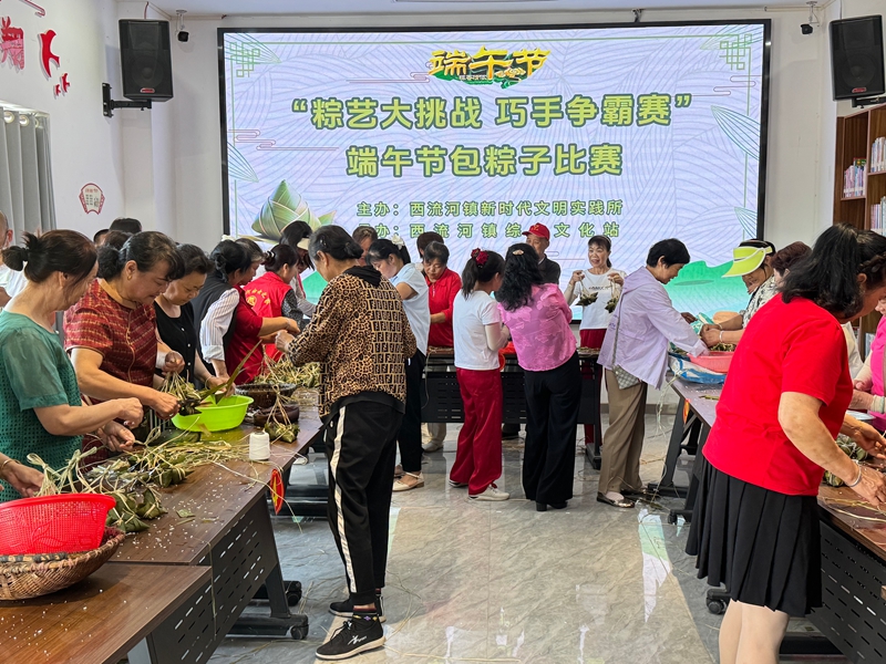 2025年5月30日，仙桃市西流河镇新时代文明实践所举行端午节“粽艺大挑战 巧手争霸赛”.jpg